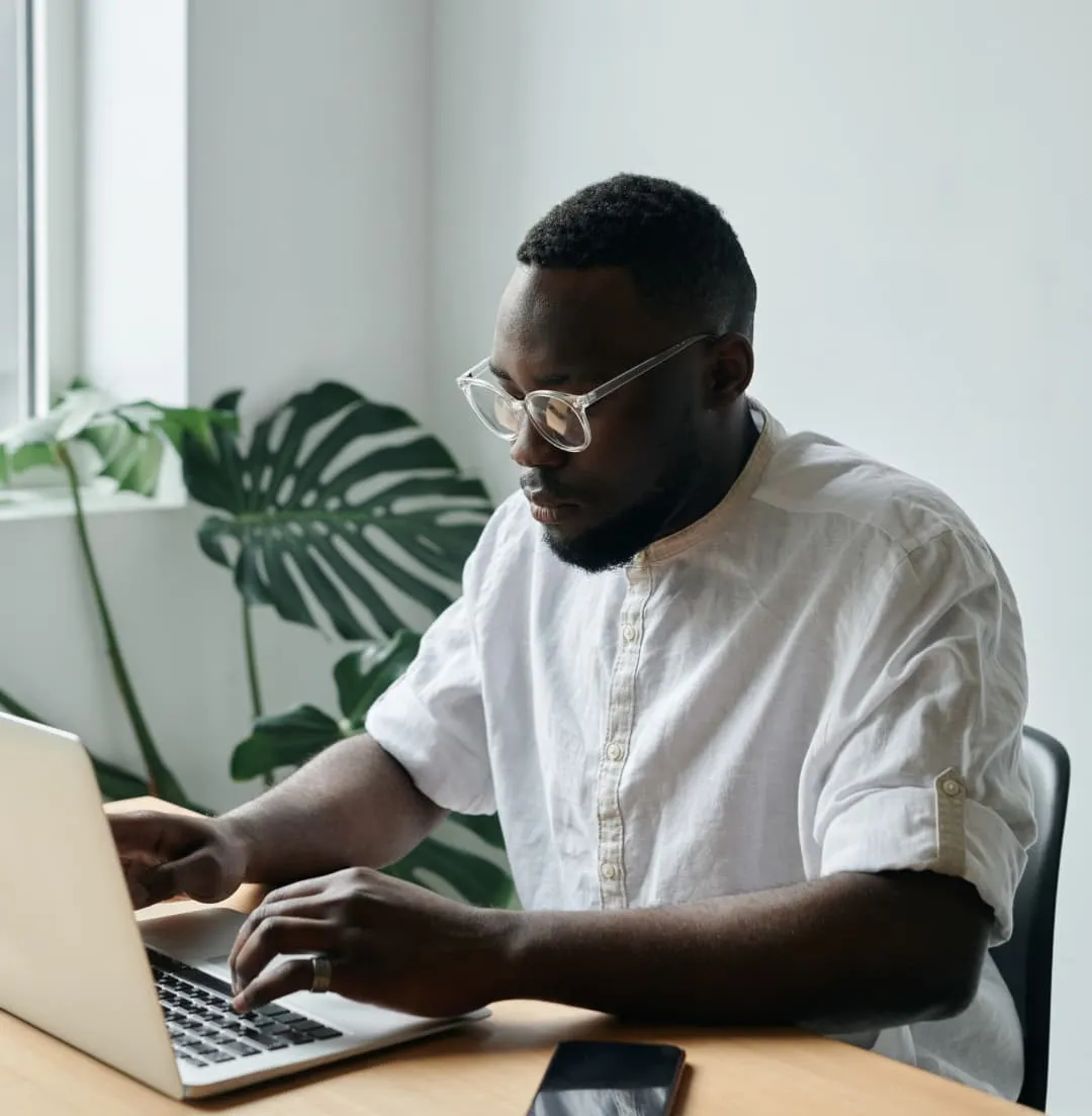 Man typing on laptop